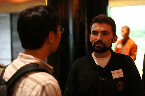 Jeremiah Dirnberger, Canadian Pacific Railroad, talking with a student about railroad engineering careers